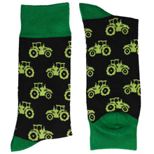 Load image into Gallery viewer, A pair of folded men&#39;s tractor pattern socks on a black background