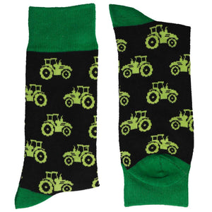 A pair of folded men's tractor pattern socks on a black background