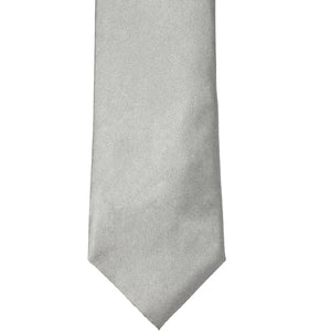 The front of a mercury silver solid tie, laid out flat