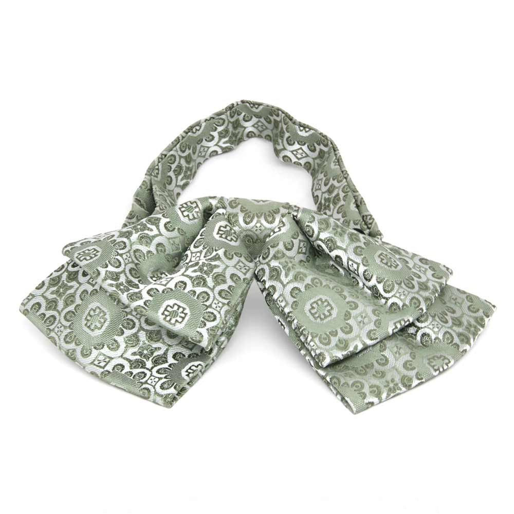 Front view of a mint green floral pattern floppy bow tie