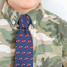 Load image into Gallery viewer, A boy wearing a camo button down shirt with a dark blue tie covered in mom heart tattoos