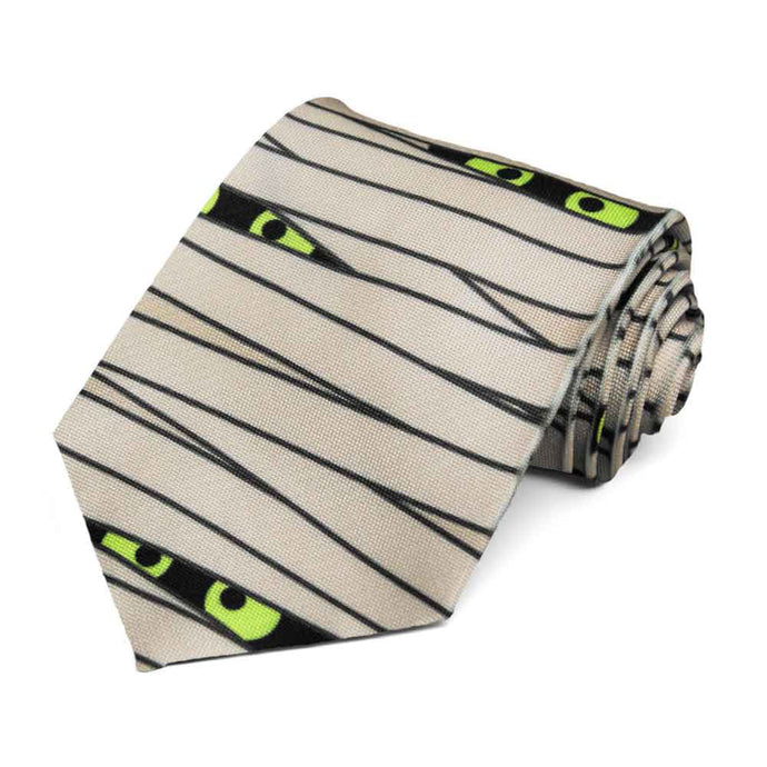 A men's novelty tie wrapped in mummy gauze with creepy eyeballs peeking out