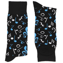 Load image into Gallery viewer, A folded pair of black socks with turquoise and white music notes