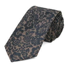 Load image into Gallery viewer, Navy blue and tan floral tie, rolled to show the rich woven texture