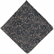 Load image into Gallery viewer, A folded tan pocket square with a navy blue floral pattern