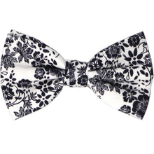 Load image into Gallery viewer, A navy blue and white floral men&#39;s pre-tied bow tie