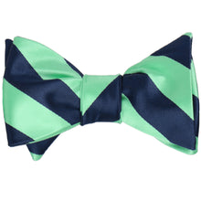 Load image into Gallery viewer, Navy blue and bright mint striped self-tie bow tie, tied