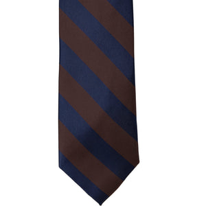 The front of a navy blue and brown striped tie