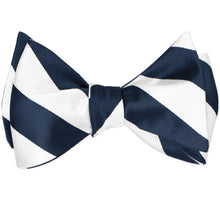 Load image into Gallery viewer, Navy blue and white striped self-tie bow tie, tied