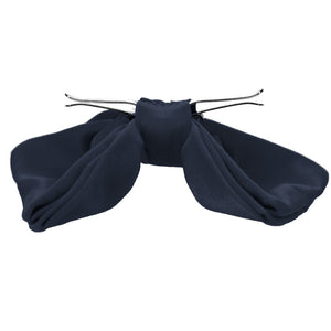 The side view of a dark navy blue clip-on bow tie, opened