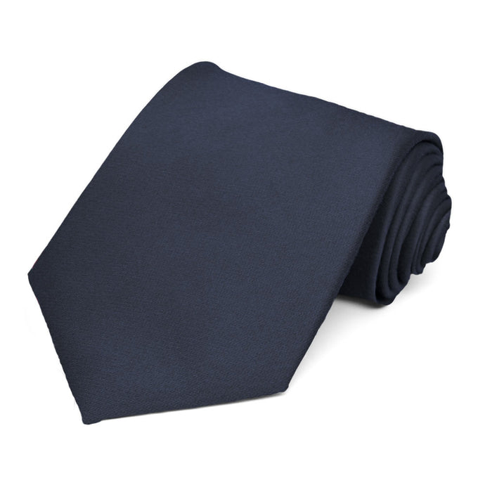 Solid navy blue extra long tie, rolled to show woven texture