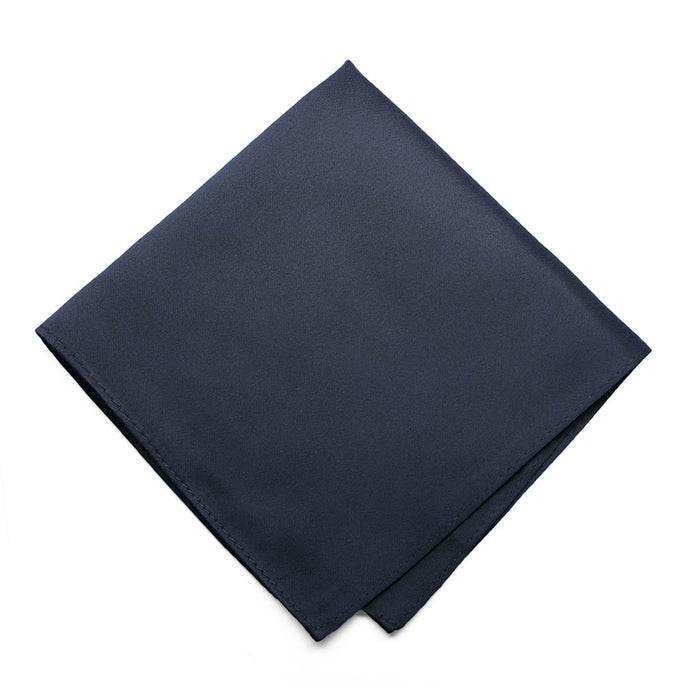 A folded solid navy blue pocket square