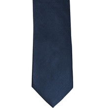 Load image into Gallery viewer, The front of a navy blue herringbone tie, laid out flat