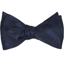 Load image into Gallery viewer, A navy blue self-tie bow tie, tied, in tone-on-tone stripes