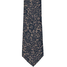 Load image into Gallery viewer, The front of a navy and tan floral tie with a lace like look