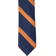 Load image into Gallery viewer, The front of a navy tie with orange ribbed stripes
