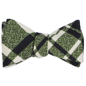 A tied self-tie bow tie in a chunky olive green and off white plaid
