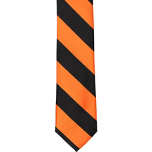 Load image into Gallery viewer, The front of an orange and black striped skinny tie, laid out flat