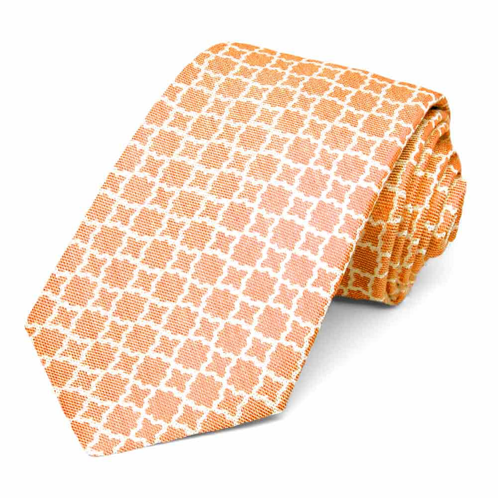 Rolled view of an orange and white trellis pattern tie