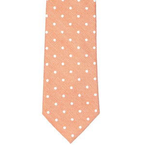 Front view of an orange and white polka dot tie