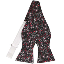 Load image into Gallery viewer, An untied black self-tie bow tie with pink and red paisley swirled with hearts