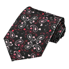 Load image into Gallery viewer, A black novelty tie with an all over paisley heart pattern, rolled to show off design