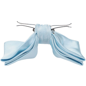 The side view of a pale blue clip-on bow tie
