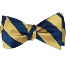 Load image into Gallery viewer, Pale gold and twilight blue striped self-tie bow tie, tied