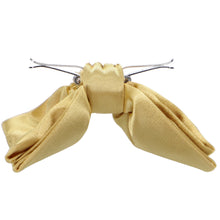 Load image into Gallery viewer, Side view of a pale gold clip-on bow tie