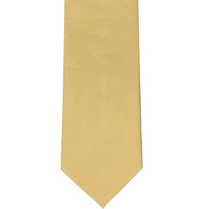 The front of a pale gold herringbone tie, laid out flat