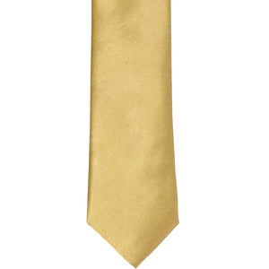 The front of a pale gold slim tie, laid out flat