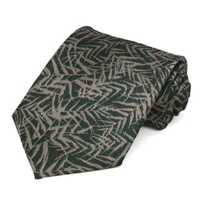 Green and tan palm leaf patterned necktie rolled to show off texture
