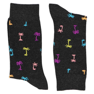 A pair of folded pattern tree novelty socks in black and bright colors