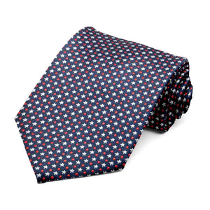 Navy blue necktie with tiny white stars and red dots, rolled to show pattern up close