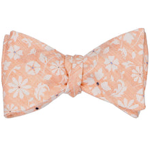 Load image into Gallery viewer, A tied self-tie bow tie with a white and peach floral pattern