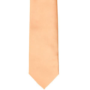 Front view of a peach slim tie