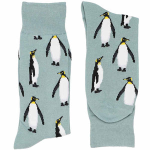 A pair of gray folded socks with large emperor penguins