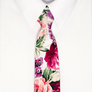 A vibrant peony floral tie on a white dress shirt