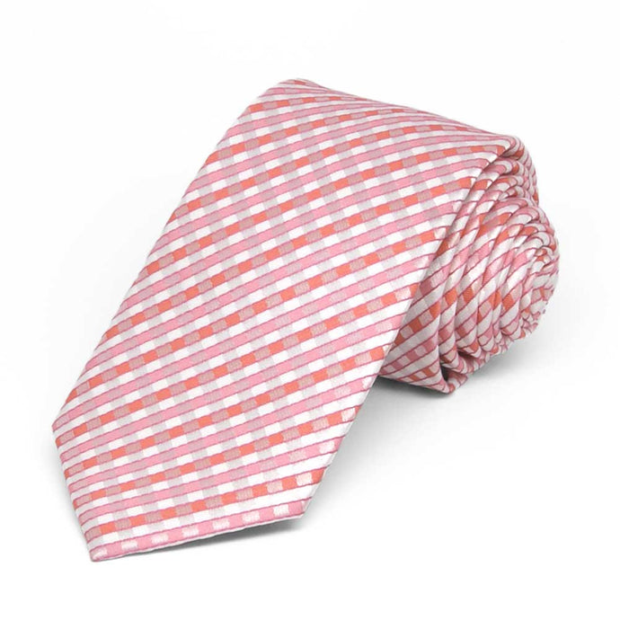 Slim pink and white plaid necktie, rolled to show pattern up close