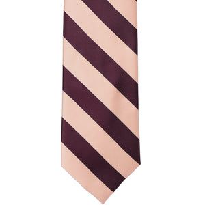 The front of a petal and wine striped tie, laid out flat