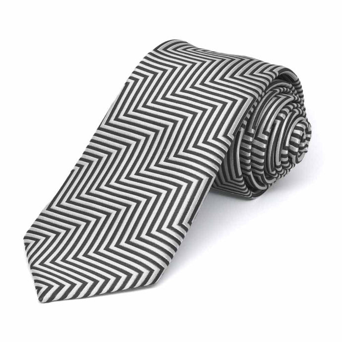 Rolled view of a gray and white chevron pattern slim necktie