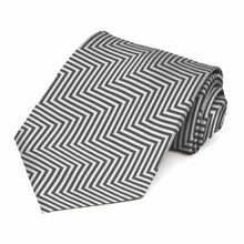 Load image into Gallery viewer, Gray and white chevron striped tie, rolled to show pattern up close