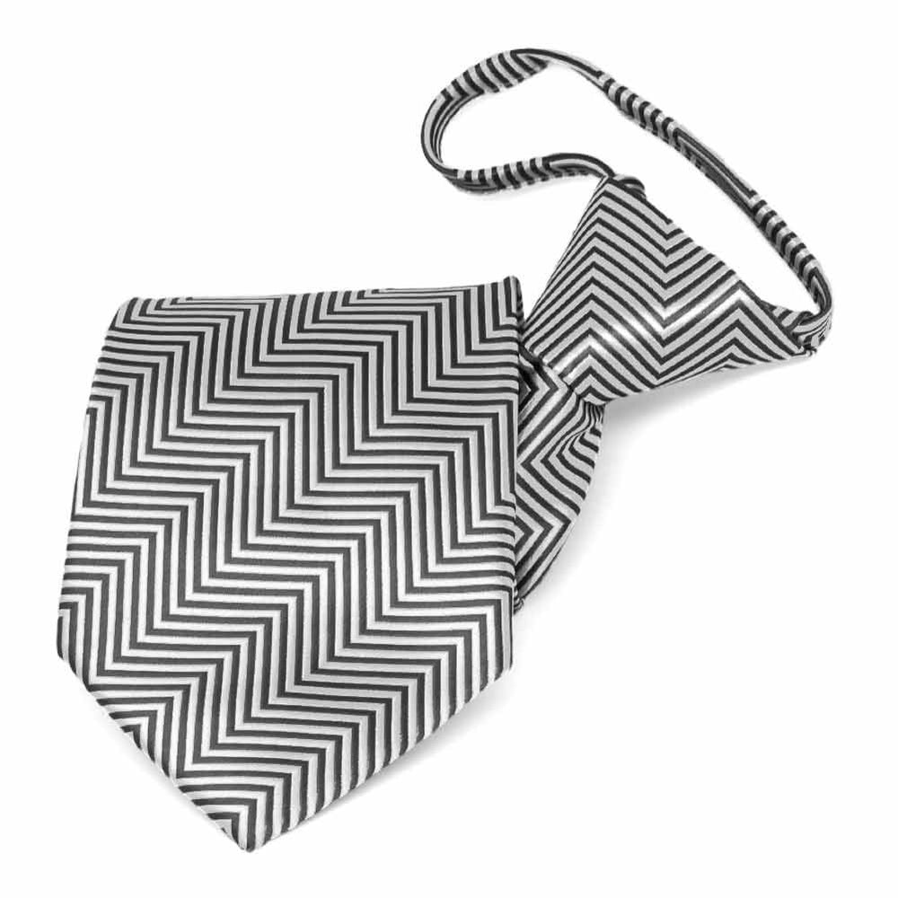 Folded view of a gray and white chevron pattern zipper style tie