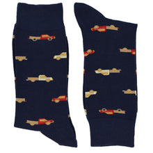 Load image into Gallery viewer, A pair of men&#39;s navy blue socks with a pickup truck pattern