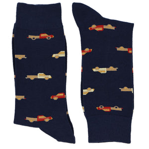 A pair of men's navy blue socks with a pickup truck pattern