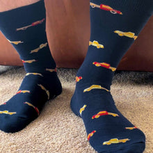 Load image into Gallery viewer, A man wearing a pair of navy socks with a pickup truck design