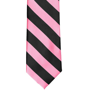 The front of a pink and black striped tie, laid out flat