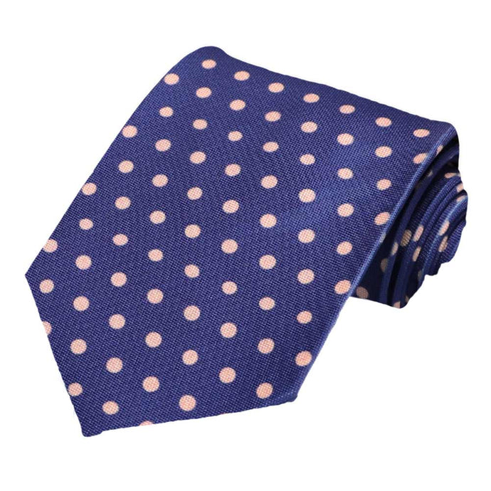 A dark blue and subtle pink polka dot tie