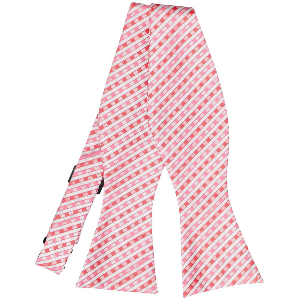 Pink and white plaid self-tie bow tie, untied flat front view