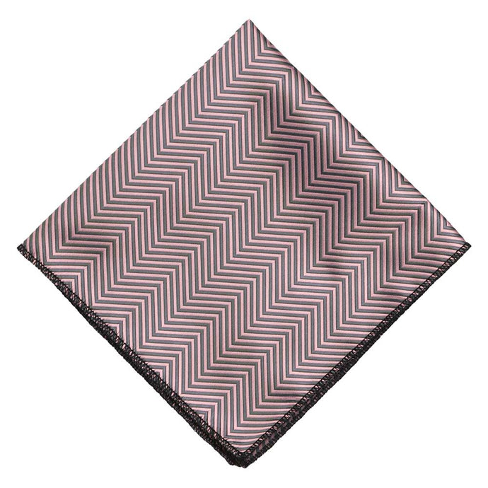 A pink and gray pocket square, folded to a diamond